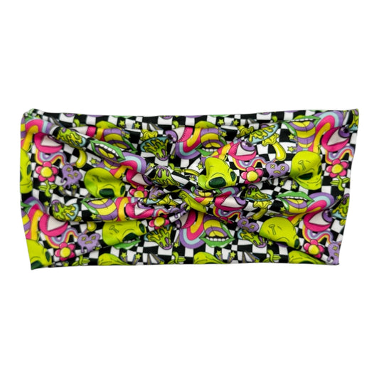 Colorful patterned pouch with checkered border on a white background