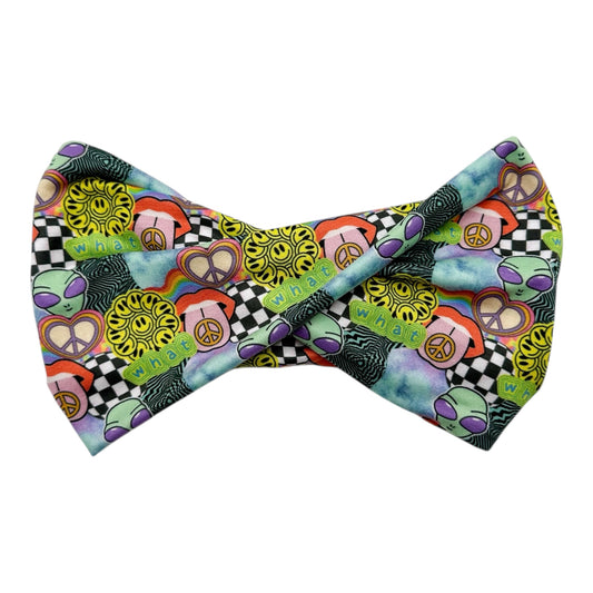 Colorful bow tie with peace signs and checkered patterns on a white background