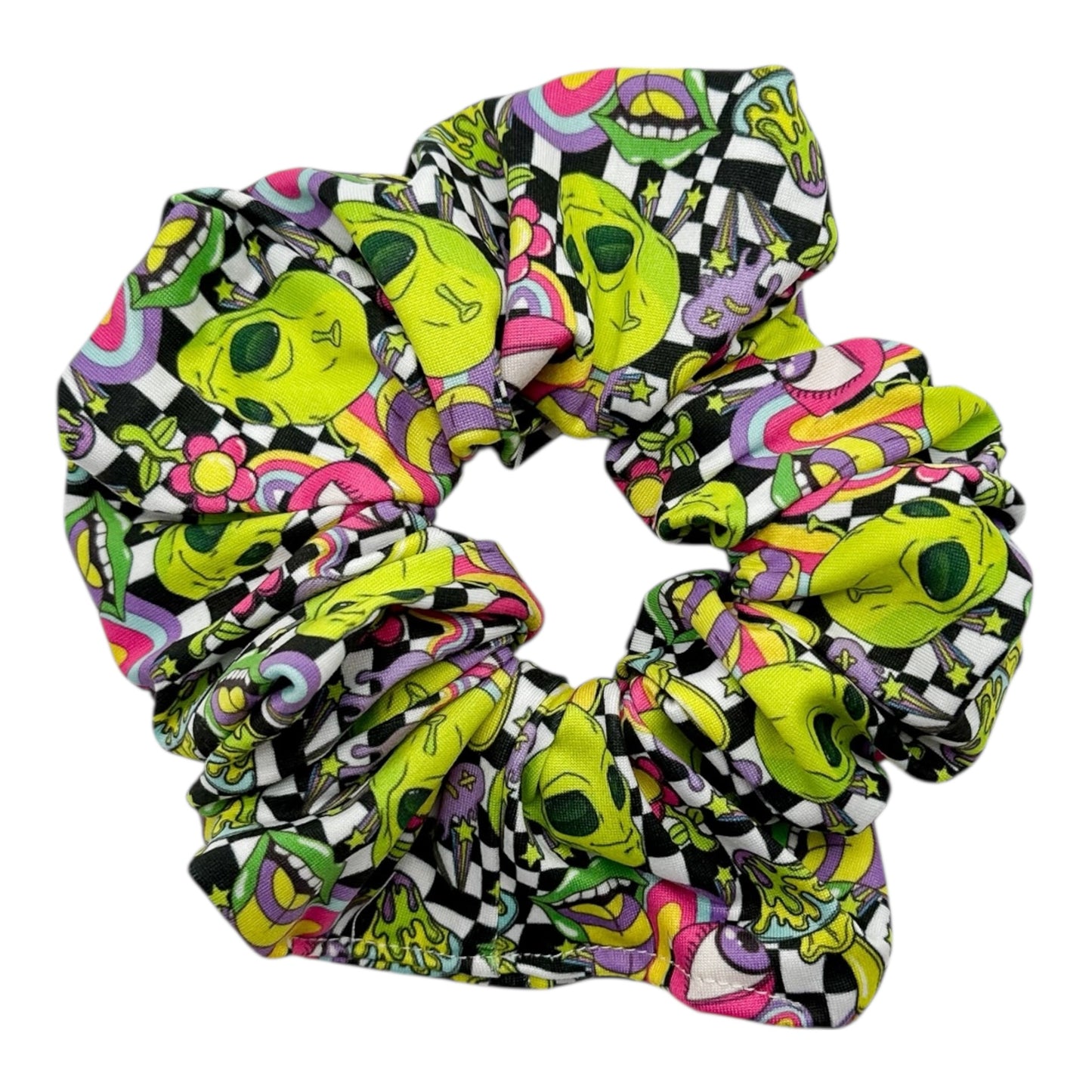 Colorful alien patterned scrunchie on a white background
