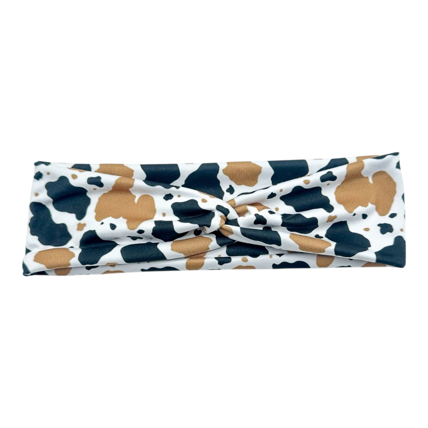 Headband with cow print pattern on a white background